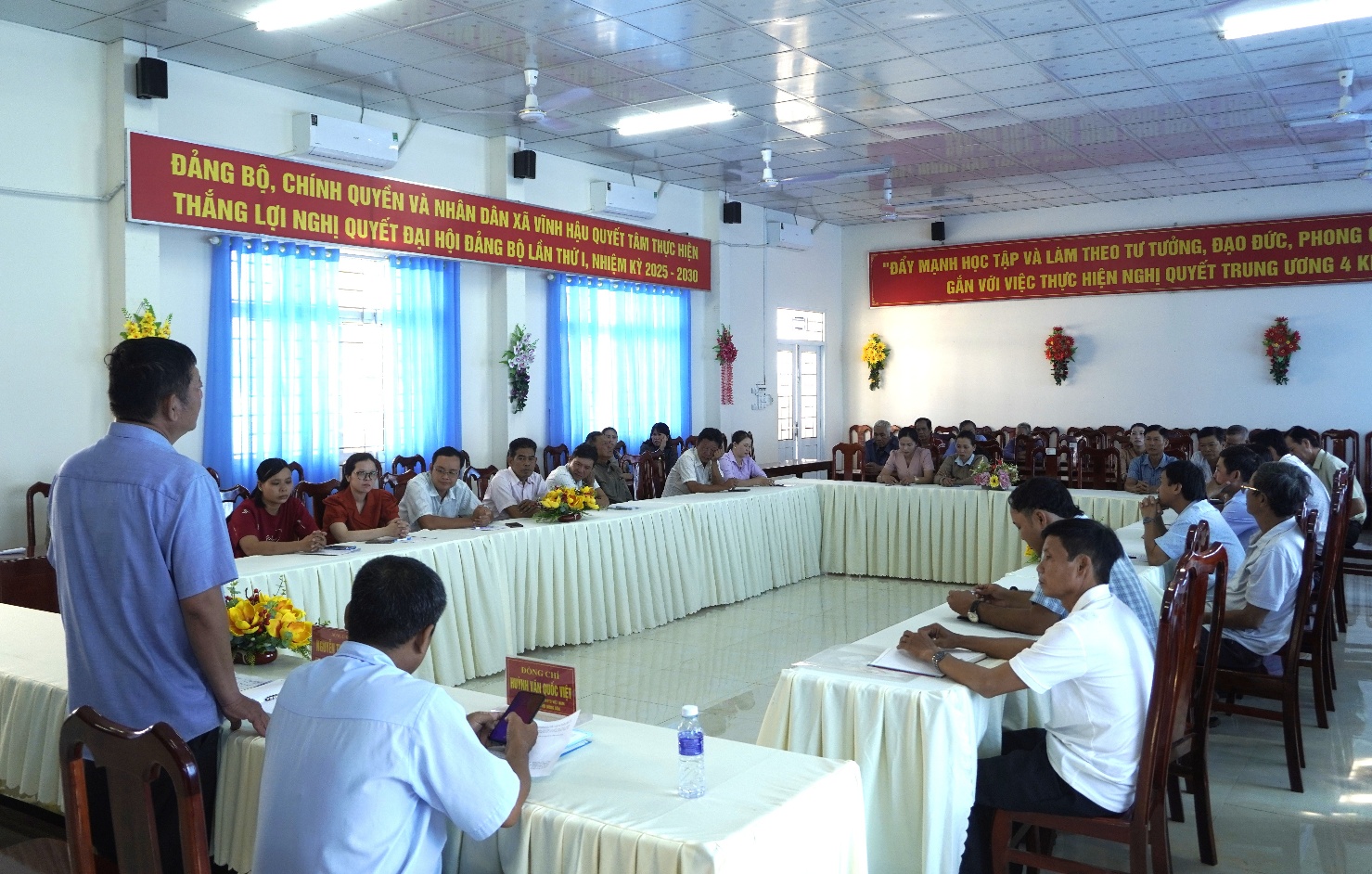 A group of people sitting at tablesAI-generated content may be incorrect.